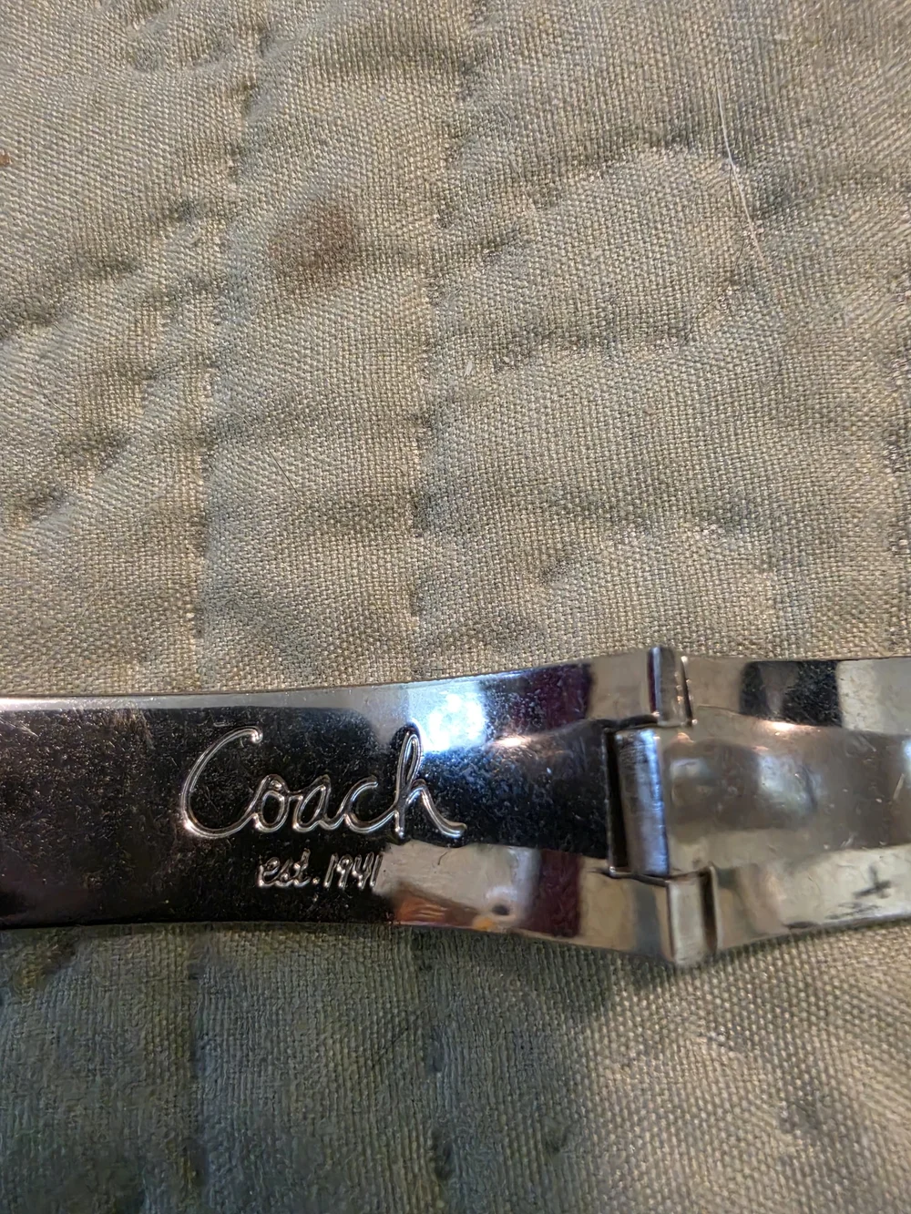 Coach polished silver